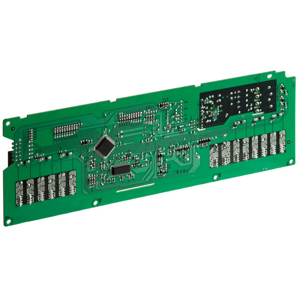 A close up of a green circuit board with many electronic components.