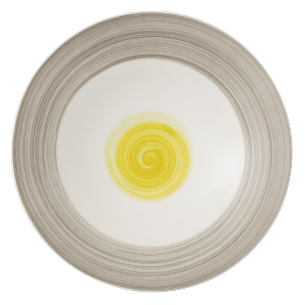 A white porcelain Villeroy & Boch deep coupe plate with a yellow date flower and yellow swirl.