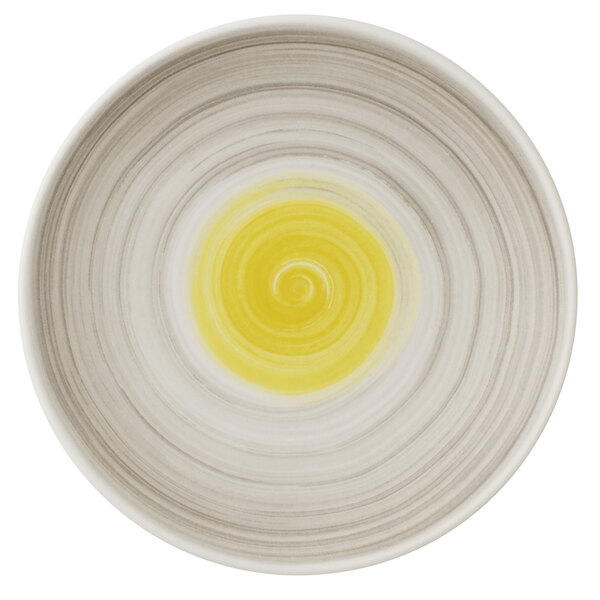 A Villeroy & Boch Amarah porcelain plate with a yellow and white swirl design in the middle.