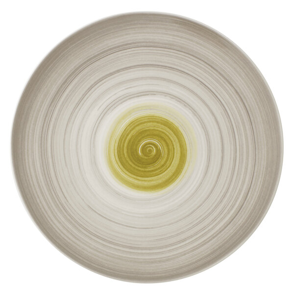 A Villeroy & Boch white porcelain plate with a yellow and green swirl design.