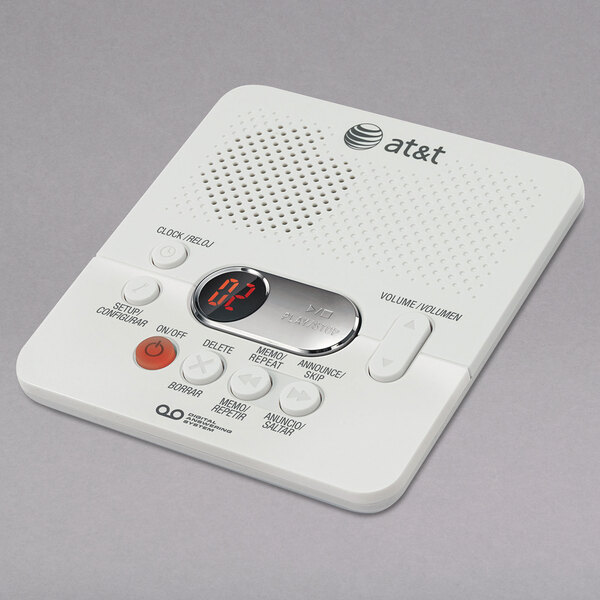 A white electronic device with buttons and a red button.