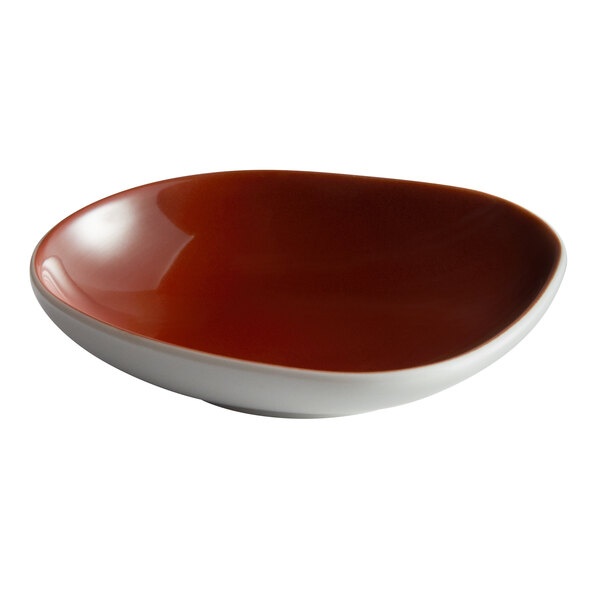 A red and white Schonwald porcelain dip dish.