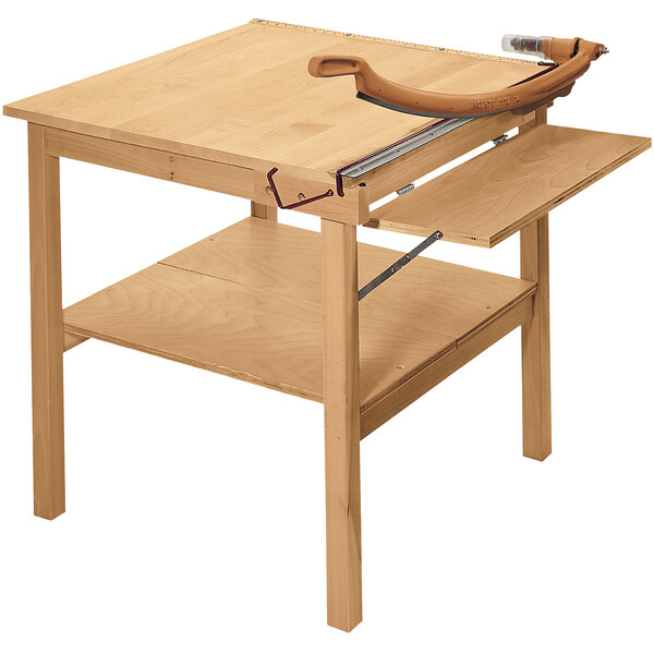 A Swingline ClassicCut guillotine paper trimmer on a wooden table.