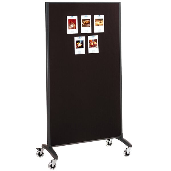 A black Quartet room divider with whiteboard and fabric bulletin board surfaces.