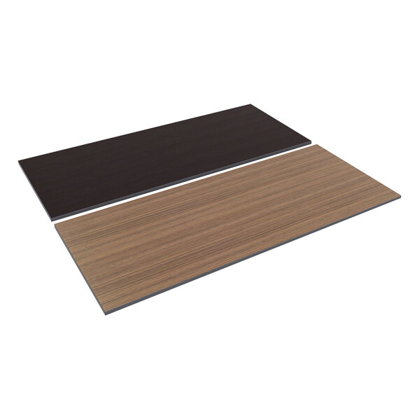 A black rectangular table top with a wood surface on a brown table.