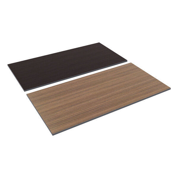 A black rectangular object with a wood and brown laminate surface.