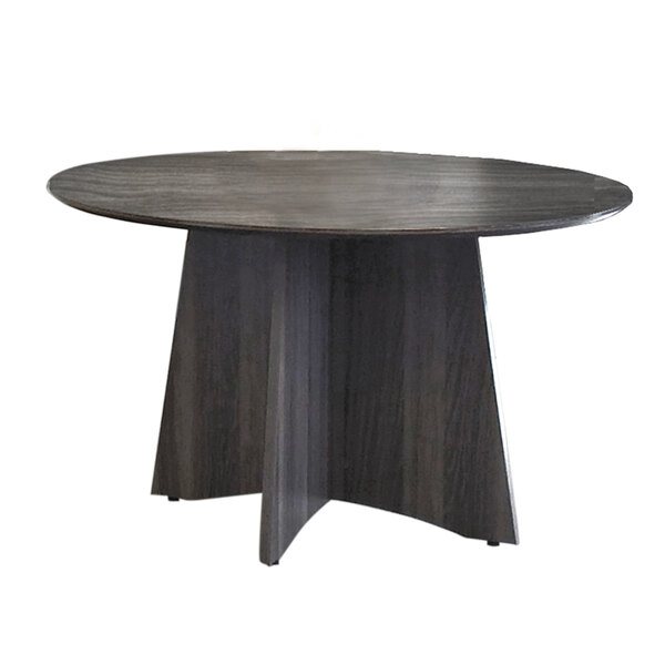 A Safco Medina round wood conference table with curved legs and a gray top.