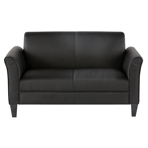 A black leather Alera loveseat with wooden legs.