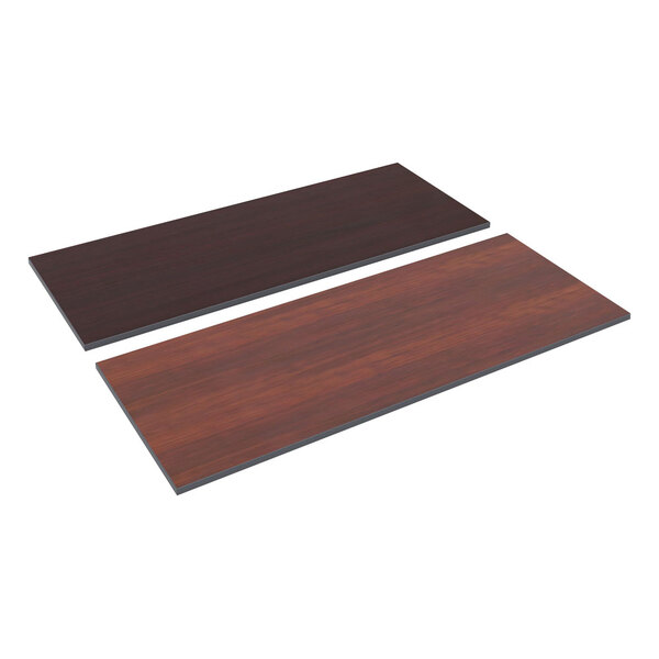 A rectangular Alera cherry and mahogany reversible laminate table top on a table.
