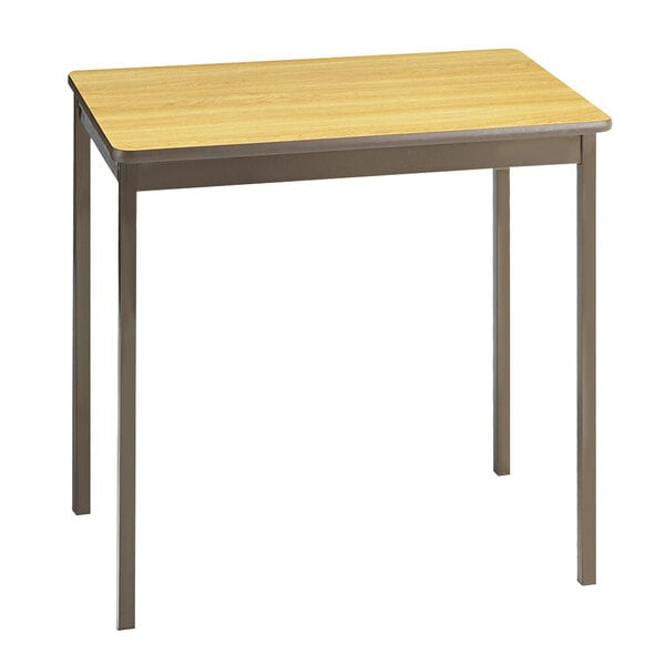 A Barricks oak utility table with a rectangular wooden top and metal legs.