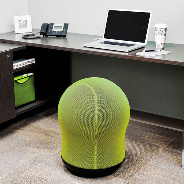 A Safco Zenergy green mesh ball chair in a corporate office cafeteria.