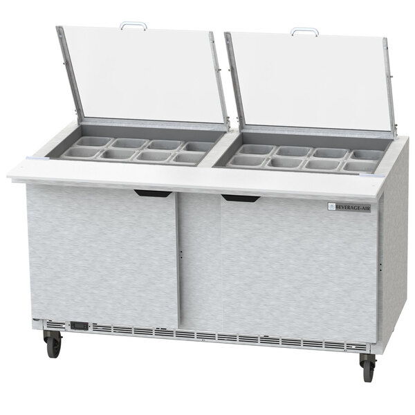 A Beverage-Air stainless steel sandwich prep table with two open doors on a counter.