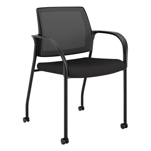 A black HON Ignition Series office chair with wheels and black mesh back.