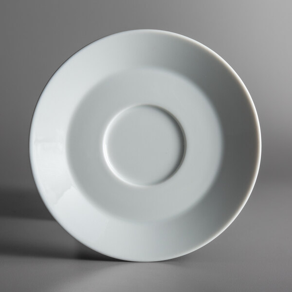 A Schonwald white porcelain saucer with a circle in the middle.