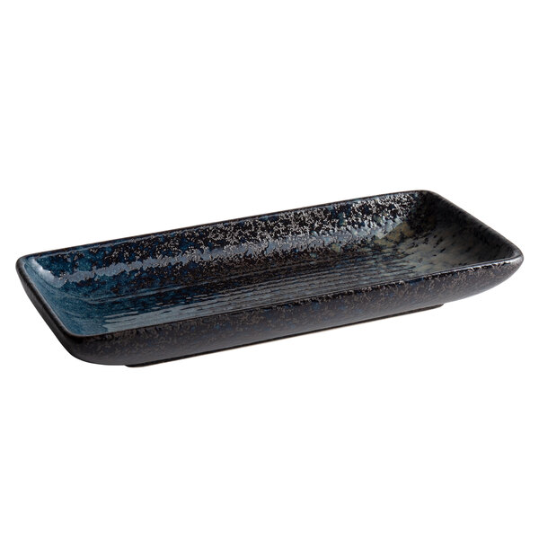 A Playground rectangular stoneware platter with blue and black speckles.