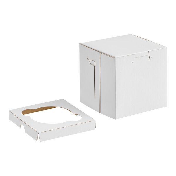 A white cardboard box with a separate insert featuring a single circular slot, both placed on a plain background.