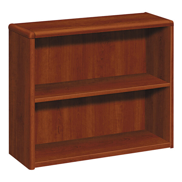 A HON cognac wood bookcase with shelves.