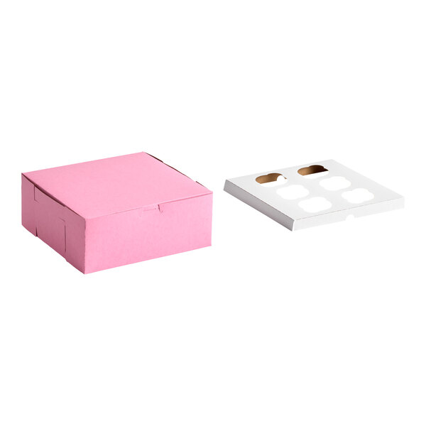 A pink cardboard cupcake or muffin box with a separate white reversible insert featuring six slots.