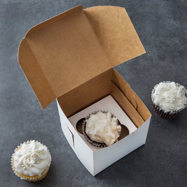 A Baker's Mark white cupcake box with one cupcake inside.