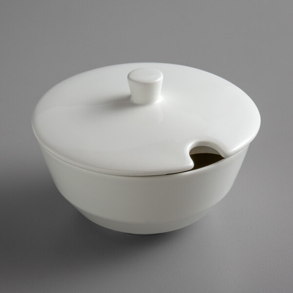 A Schonwald bone white porcelain sugar bowl with a lid.