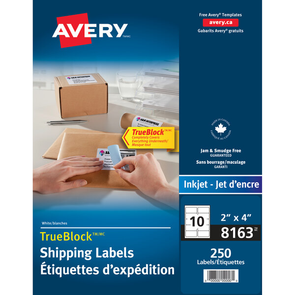 A hand holding an Avery rectangle shipping label.