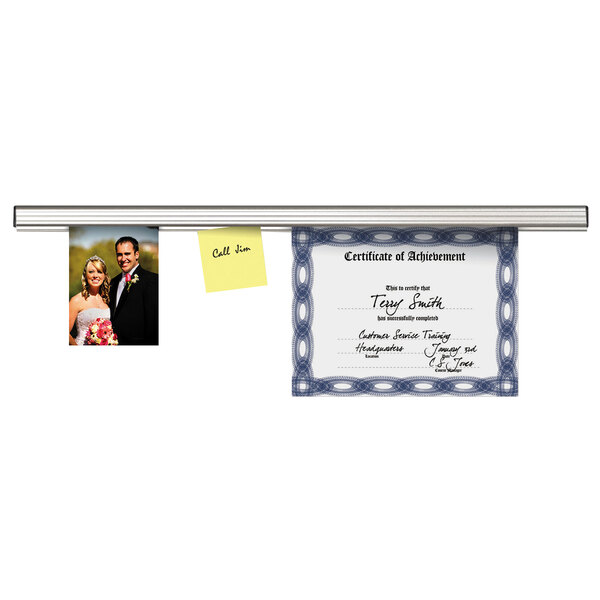 A certificate and post-it notes displayed on an Advantus aluminum grip bar.