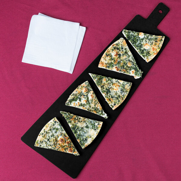 A Cal-Mil trapezoid wooden board with a slice of pizza topped with cheese and spinach.