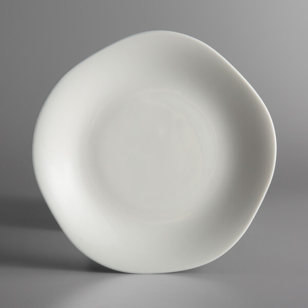 A white Oneida Lancaster Garden porcelain plate with a curved edge.