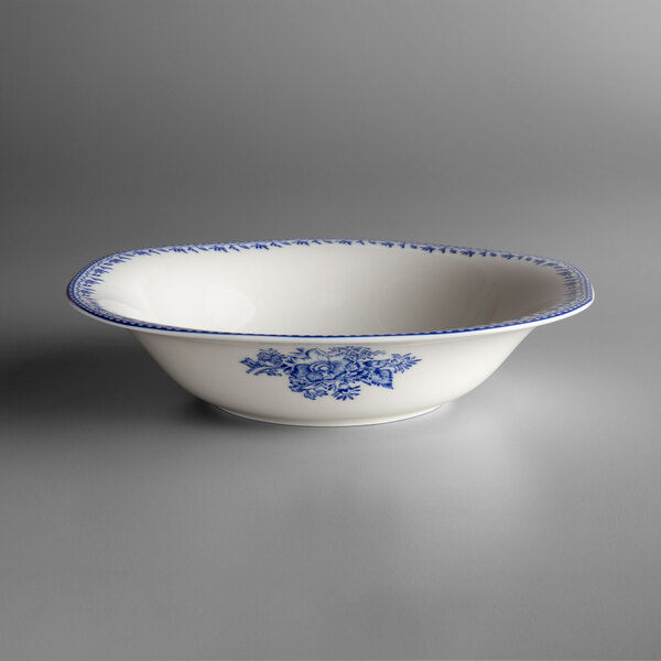 A white Oneida Lancaster Garden porcelain bowl with a blue and white floral design.