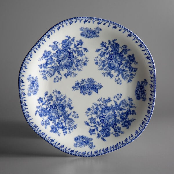 A Oneida Lancaster Garden blue porcelain plate with a blue and white floral design.