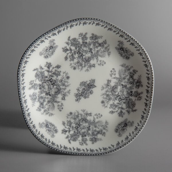 A grey porcelain Oneida Lancaster Garden plate with a floral design.