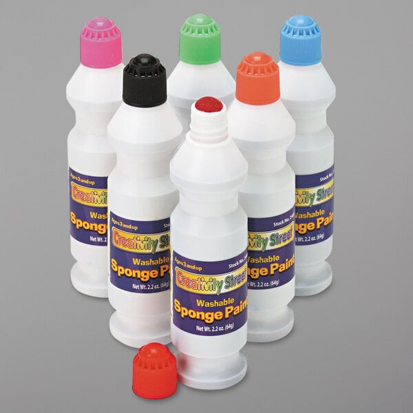 A group of six Creativity Street plastic bottles with colorful labels.