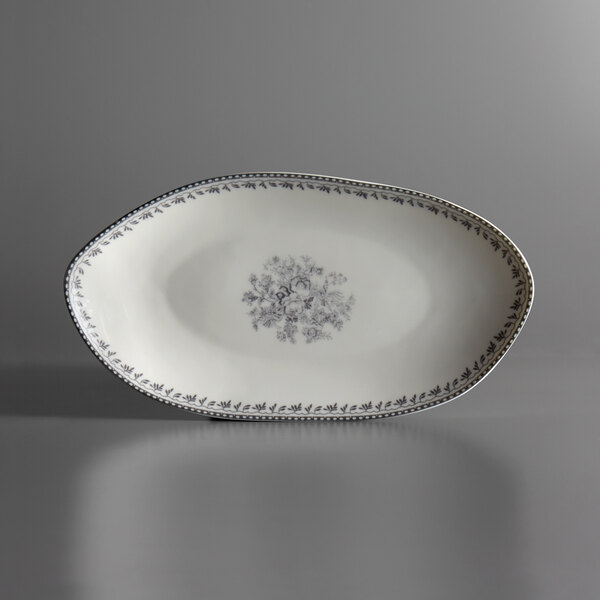 A white oval Oneida Lancaster Garden porcelain plate with a gray floral design.