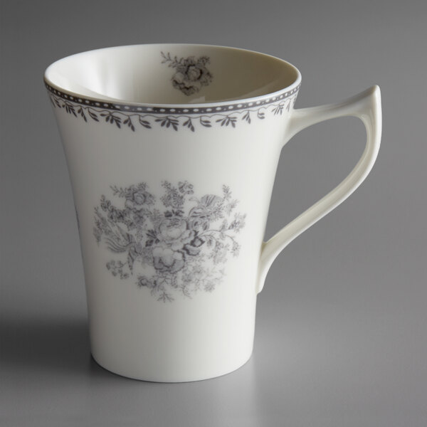 A white Oneida Lancaster Garden mug with a grey floral design.