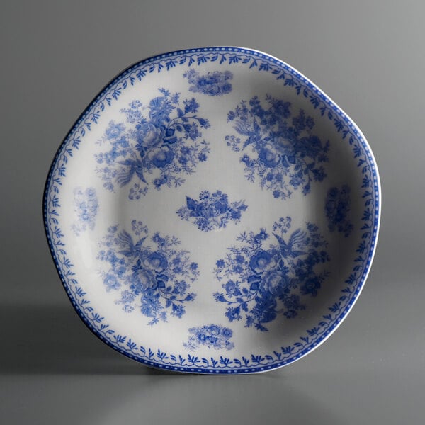 A white porcelain plate with a blue floral design.
