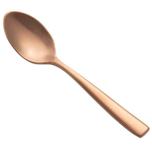 A close-up of a Bon Chef stainless steel demitasse spoon with a matte rose gold handle.