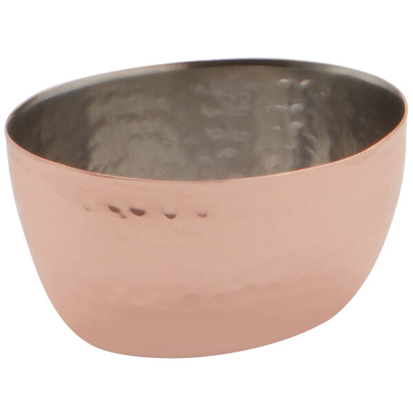 An American Metalcraft stainless steel sauce cup with a hammered copper exterior.