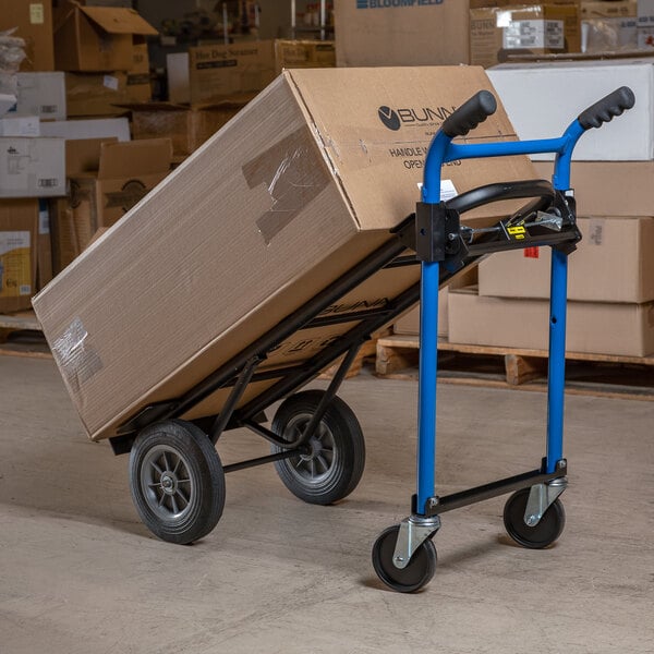 A Harper hand truck with a large box on it.