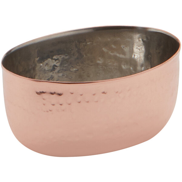 An American Metalcraft stainless steel sauce cup with a hammered copper finish.