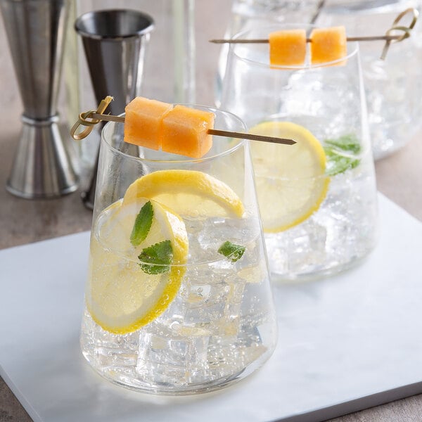 A group of glasses of Boylan Classic Seltzer with ice and lemon slices.