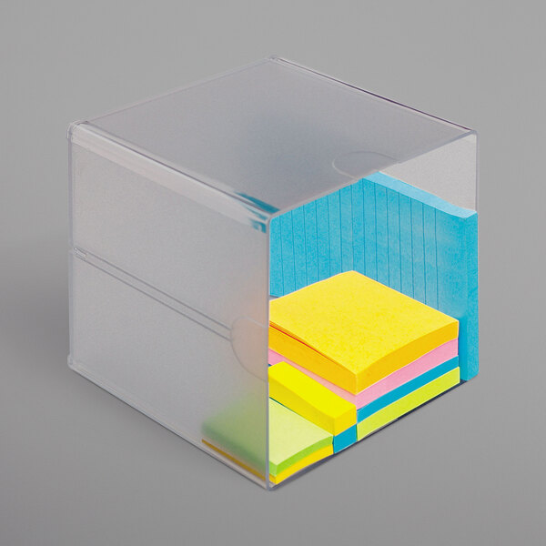 A clear plastic box with several sticky notes inside.