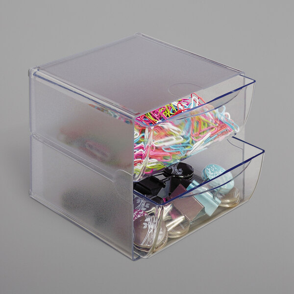 A clear plastic container with a drawer full of paper clips.