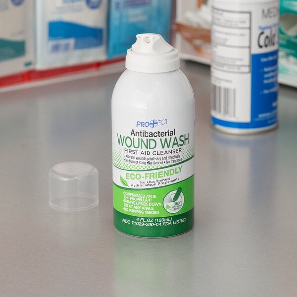 A white bottle of Medi-First Antibacterial Wound Wash with a green label.