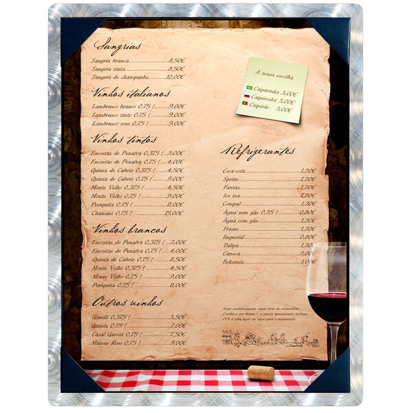 A Menu Solutions Alumitique menu board with picture corners on a table with a glass of wine.