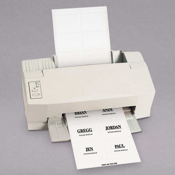 A printer with C-Line Products white name badge inserts in it.