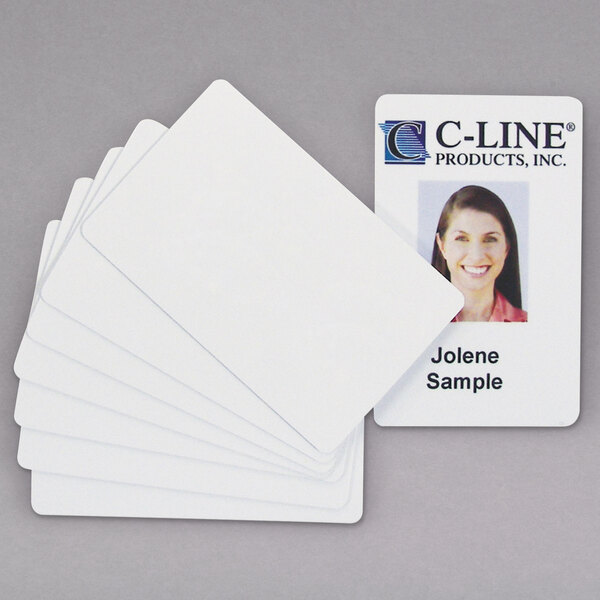 A close-up of a C-Line white PVC card with a woman's name tag.