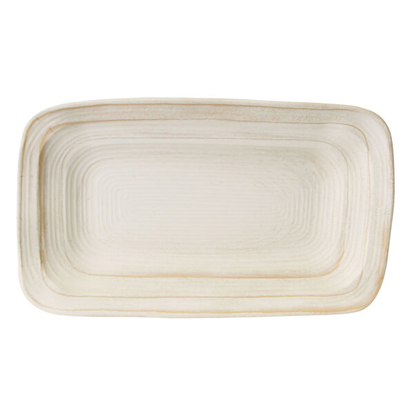 An off white rectangular plate with a thin rim.