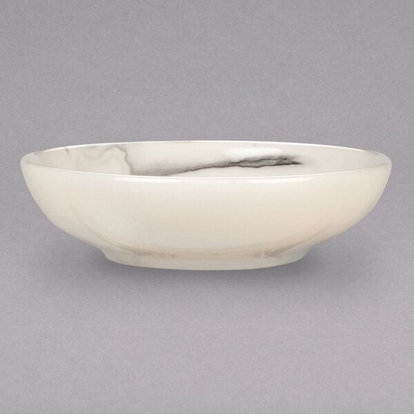 A white porcelain bowl with black swirls on the rim.
