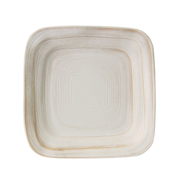 An Elite Global Solutions Della Terra off white square plate with a white border.