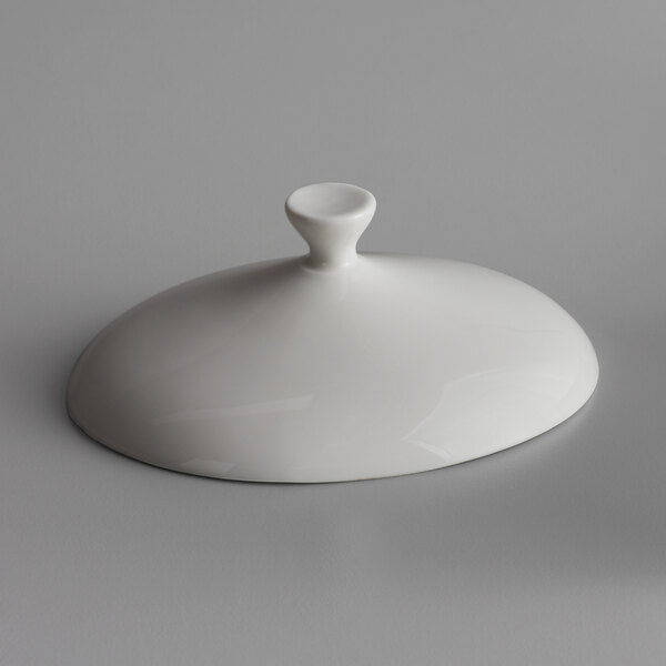 A white Libbey Royal Rideau porcelain oval crock lid with a handle.
